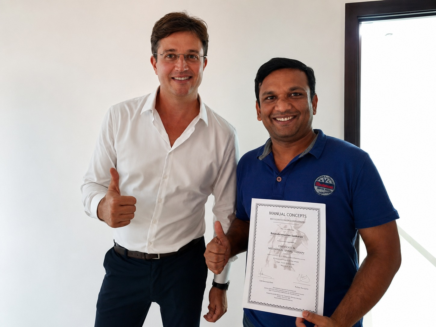 Bala receiving his certificate from tutor Vaidas Stalioraitis at the March 2018 COMT Part 3 course